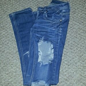 Ripped slim legged low waist jeans