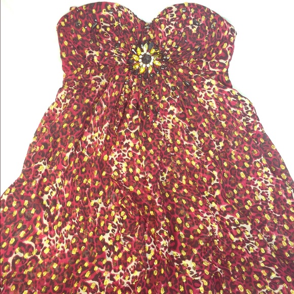 Animal print halter dress with removable strap.