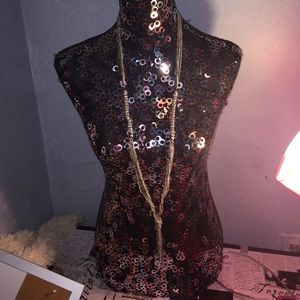 Long silver sparkly necklace.