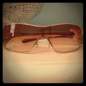 Metallic gold Oakley sunglasses