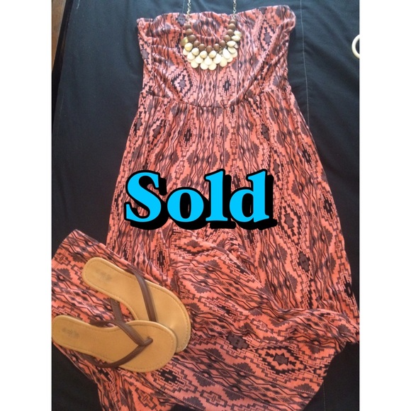 Red/orange jumpsuit.