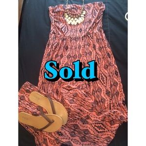 Red/orange jumpsuit.