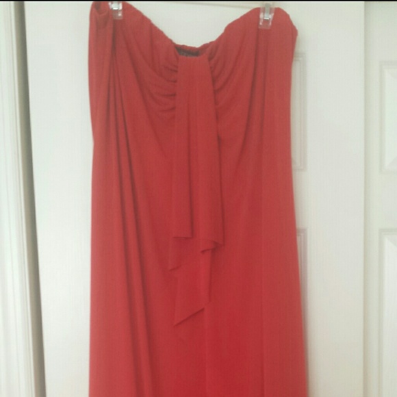 Full length, strapless, red dress with cardigan.