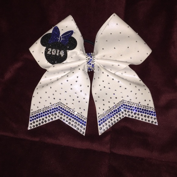 White cheer bow with blue and regular rhinestones
