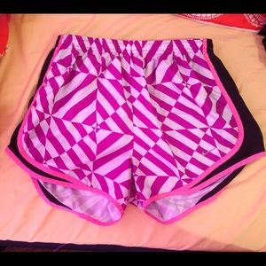 Purple pink patterned Nike running shorts medium