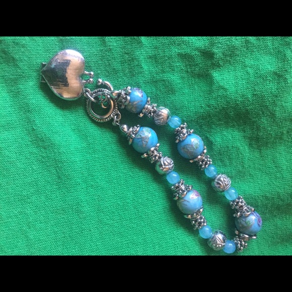 Lovely light blue bracelet with butterflies on it. - Picture 3 of 3