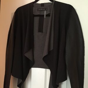 Gorgeous leather and cloth jacket with detail.