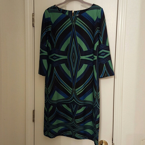 A 60 style shift dress quarter length sleeves