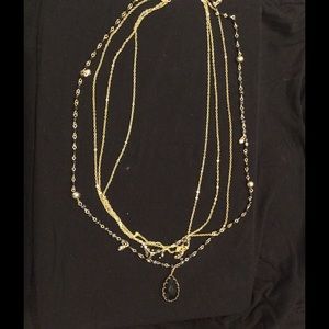 Multistrand gold and black beaded necklace