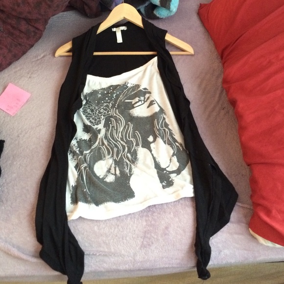 Sleeveless black and white top.