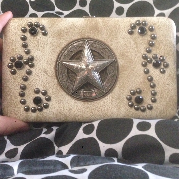 Tan wallet with Black Rimestones and a Star⭐️