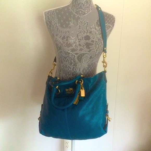 Coach handbag, in a vibrant blue color 🎨👌