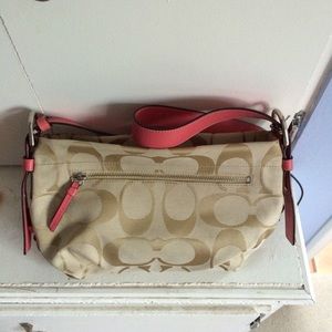Cross body adjustable strap coach purse. Tan/pink