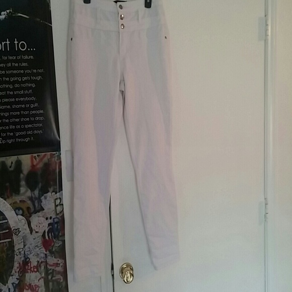 white pants with gold accents
