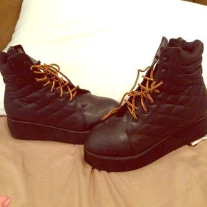 Platform leather combat boots, yellow laces