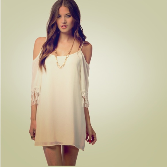 White dress with lace detail on sleeves