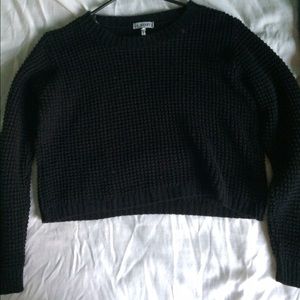 Black cable-knit sweater