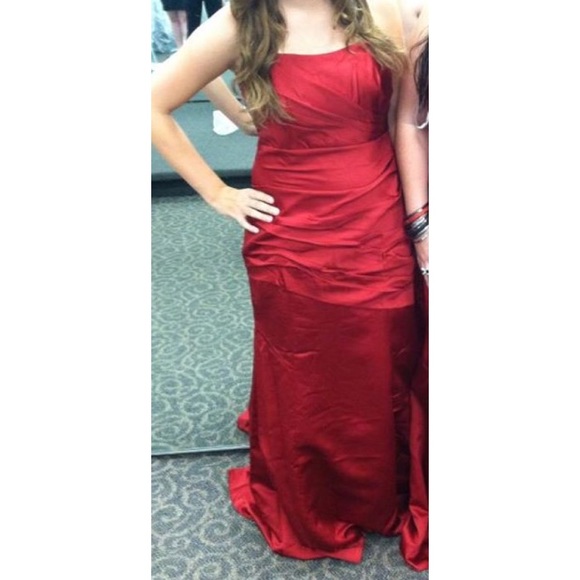 elegant red prom dress with cinches in middle