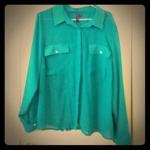 Sheer teal button up blouse.