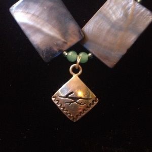 Sterling silver roadrunner charm, shell bracelet