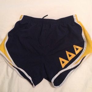 Navy and yellow Tri Delta shorts