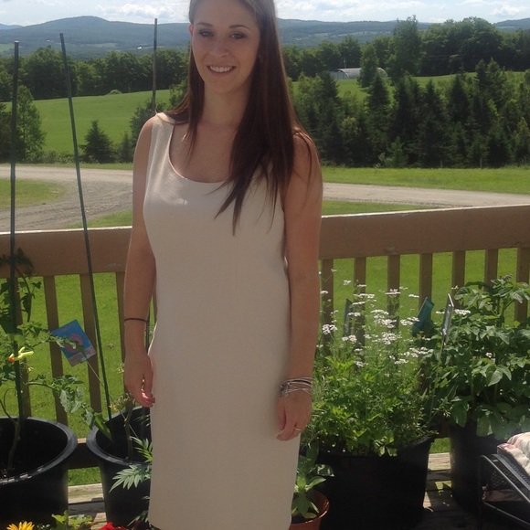Pristine cream colored, lined sheath dress.