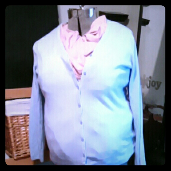 Light blue sweater.