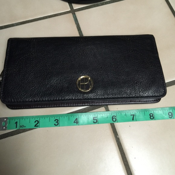 Authentic Henri Bendel empire travel wallet.