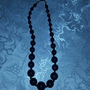 Lovely navy blue necklace.