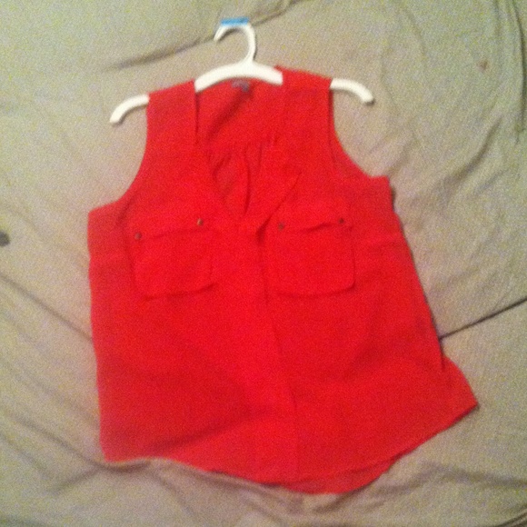 Bright orange see through shirt.