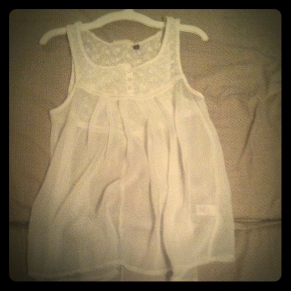 White, loose fitting shirt.