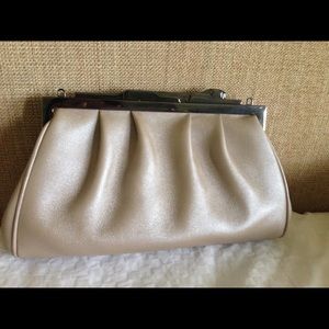 Cartier clutch with detachable strap.
