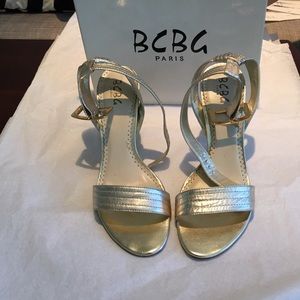 BCBG gold shoes.