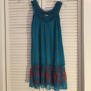 Detailed dress in blue and red.