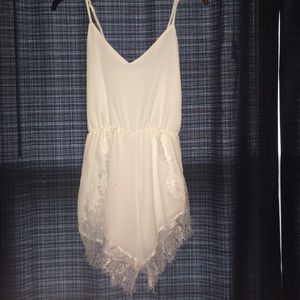 Summer white romper with lace detail