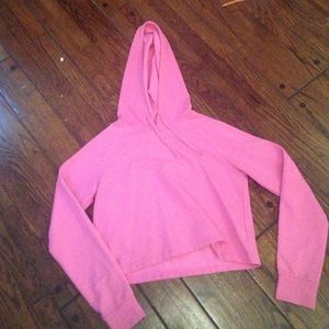 Bright pink cropped hoodie pullover.