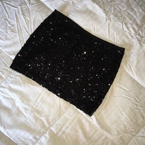 Sequined black mini skirt