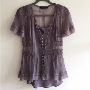 Lilac lace sheer top with romantic embellishment.