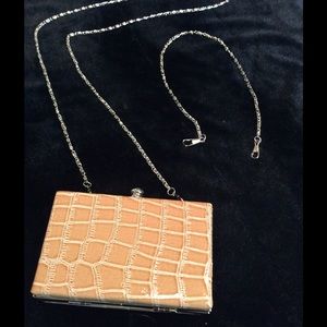 New.  Small tan clutch purse.