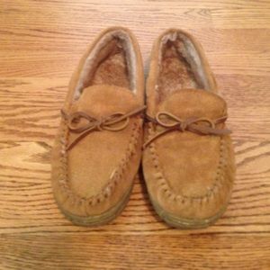Light brown moccasins with faux fur lining inside