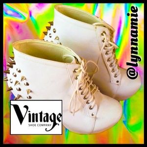 White faux leather boots with silver studs on back