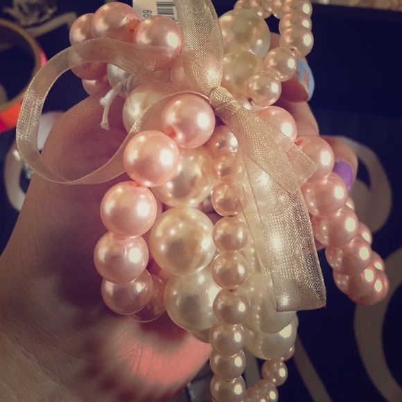 Pink and white bracelets