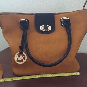 Leather brown and black color tote.