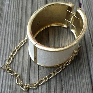 Badass white cuff with gold chain.