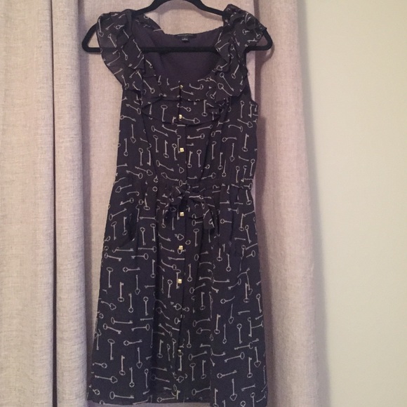 Navy dress with white key print and gold buttons
