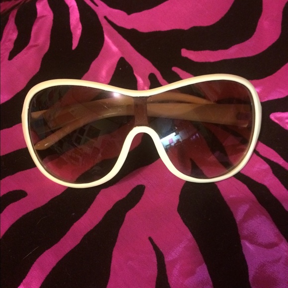 Free w/ purchase. Cream colored sunglasses.