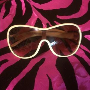 Free w/ purchase. Cream colored sunglasses.