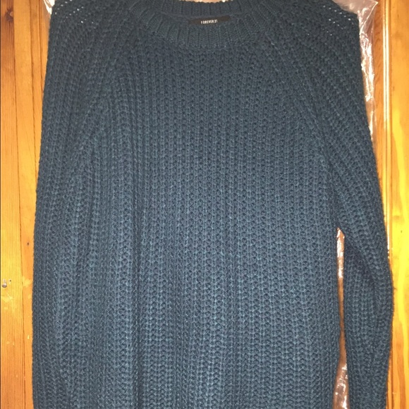 Dark green knit sweater.