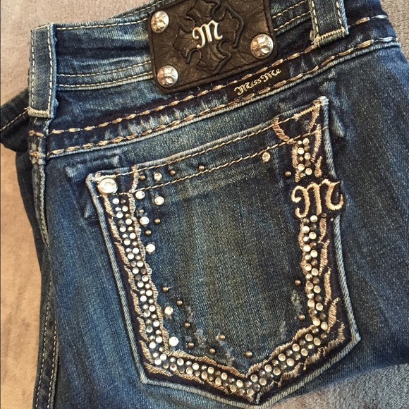 Dark wash Miss Me jeans.