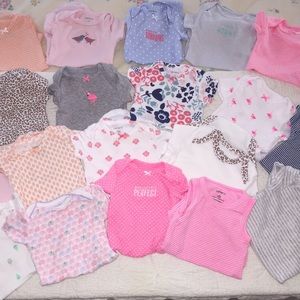 Bundle of Newborn Onesies for a Girl.